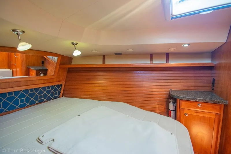 Slide: The Image of Luxurious interior of 2009 Hunter 50 Center Cockpit yacht with wood paneling and cozy lighting. - 29