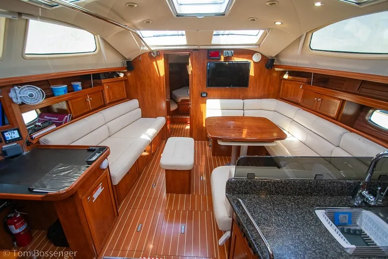 Slide: The Image of Luxurious interior of 2009 Hunter 50 Center Cockpit yacht with wood finish and seating. - 8