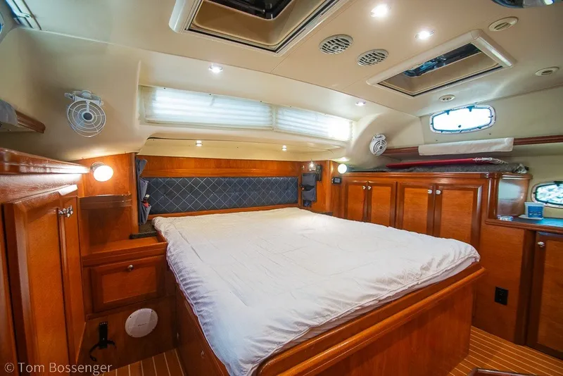 Slide: The Image of Luxurious cabin interior of 2009 Hunter 50 Center Cockpit yacht with wood finish and cozy bed. - 36