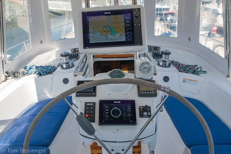 Slide: The Image of Cockpit of 2009 Hunter 50 Center Cockpit sailboat with navigation equipment and steering wheel. - 48