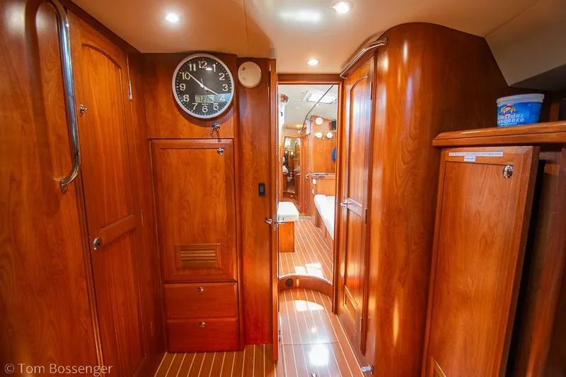 Slide: The Image of Interior of 2009 Hunter 50 Center Cockpit yacht with wooden cabinetry and clock. - 30