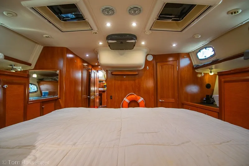 Slide: The Image of Luxurious interior of 2009 Hunter 50 Center Cockpit yacht with wood finish and cozy bed. - 38