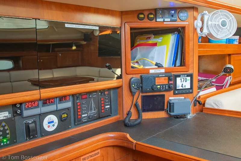 Slide: The Image of Interior of 2009 Hunter 50 Center Cockpit with navigation equipment and control panels. - 24
