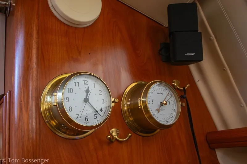 Slide: The Image of Brass clock and barometer on 2009 Hunter 50 Center Cockpit yacht interior. - 32