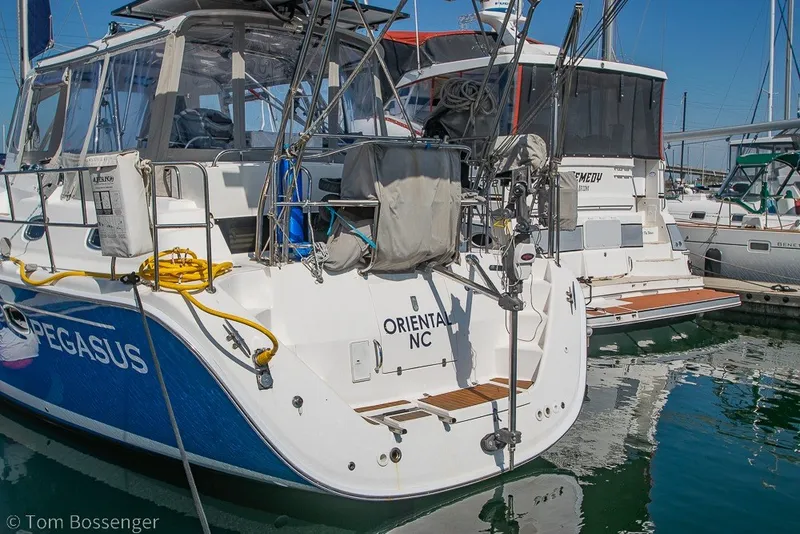 Slide: The Image of 2009 Hunter 50 Center Cockpit sailboat docked in marina, featuring "PEGASUS" and "ORIENTAL NC" markings. - 87