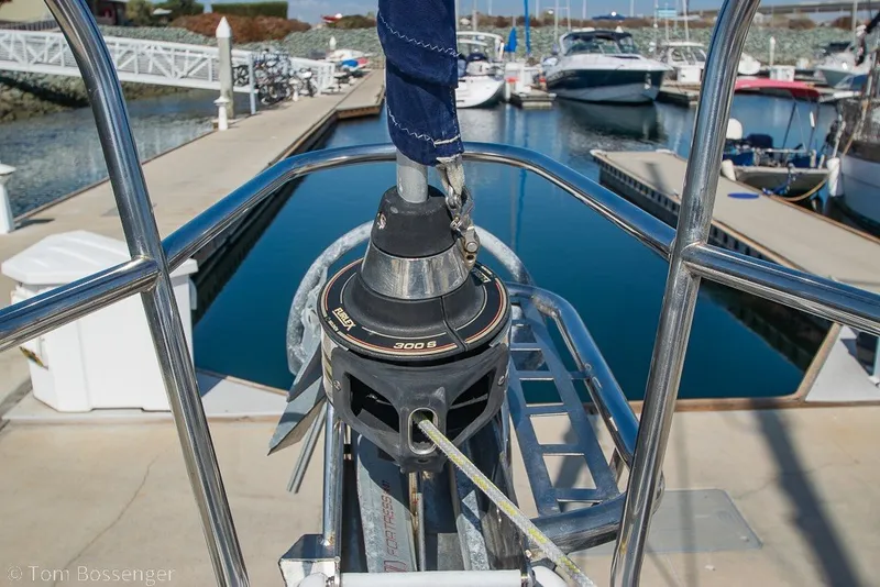 Slide: The Image of Hunter 50 Center Cockpit sailboat, 2009 model, docked at a marina with clear blue water. - 82