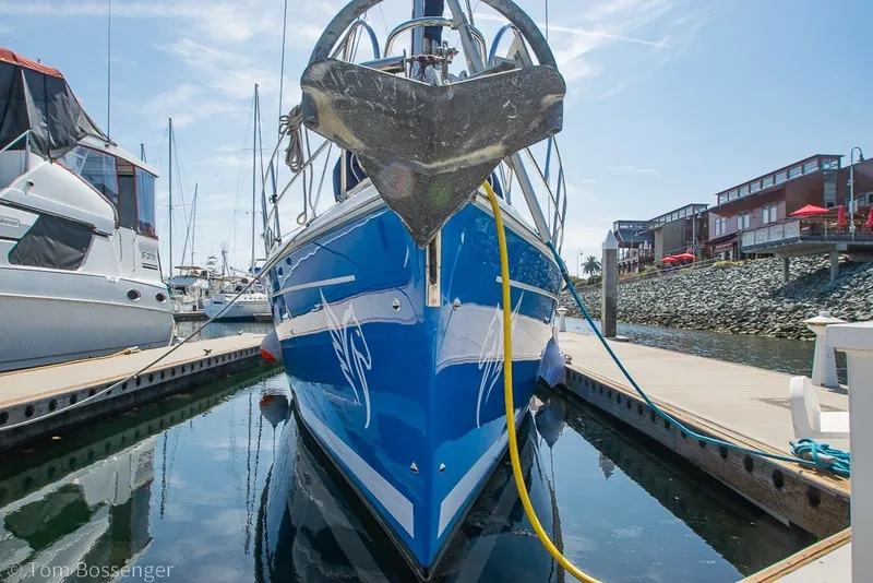 Slide: The Image of 2009 Hunter 50 Center Cockpit yacht docked at marina, reflecting in calm water. - 3