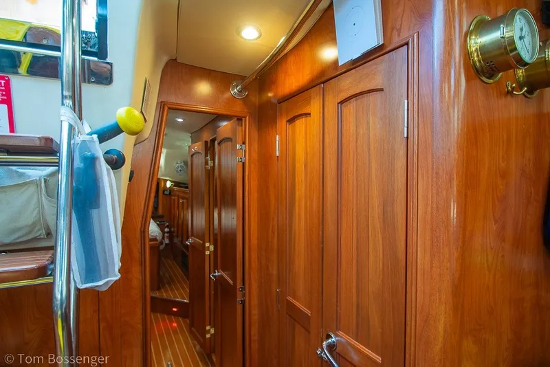 Slide: The Image of Interior of 2009 Hunter 50 Center Cockpit yacht with wooden cabinetry and nautical decor. - 34