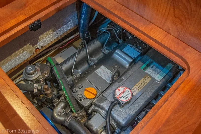 Slide: The Image of Engine compartment of a 2009 Hunter 50 Center Cockpit sailboat, showcasing detailed components. - 89