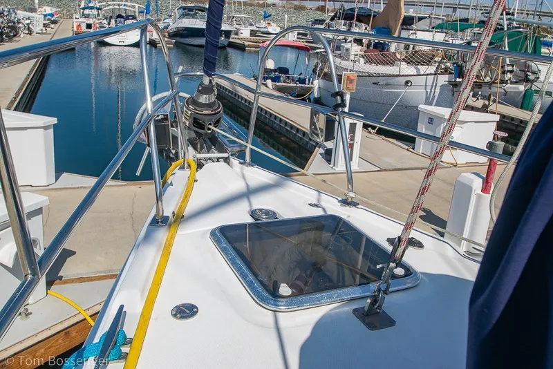 Slide: The Image of Hunter 50 Center Cockpit sailboat docked at marina, showcasing deck details, 2009 model. - 77