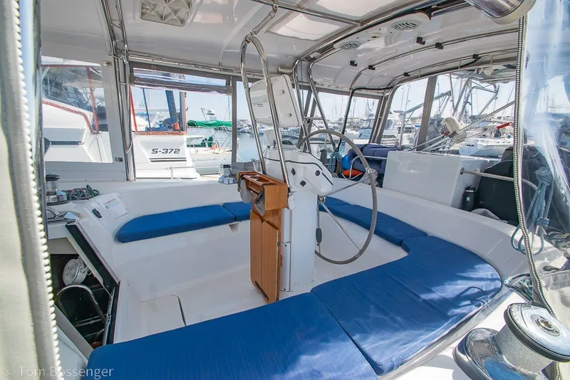 Slide: The Image of 2009 Hunter 50 Center Cockpit sailboat interior with blue seating and steering wheel. - 6