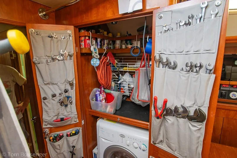Slide: The Image of Tool storage and laundry area inside a 2009 Hunter 50 Center Cockpit sailboat. - 43