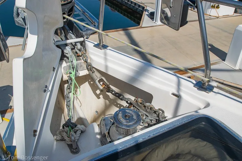 Slide: The Image of Anchor chain and winch on 2009 Hunter 50 Center Cockpit sailboat deck. - 79