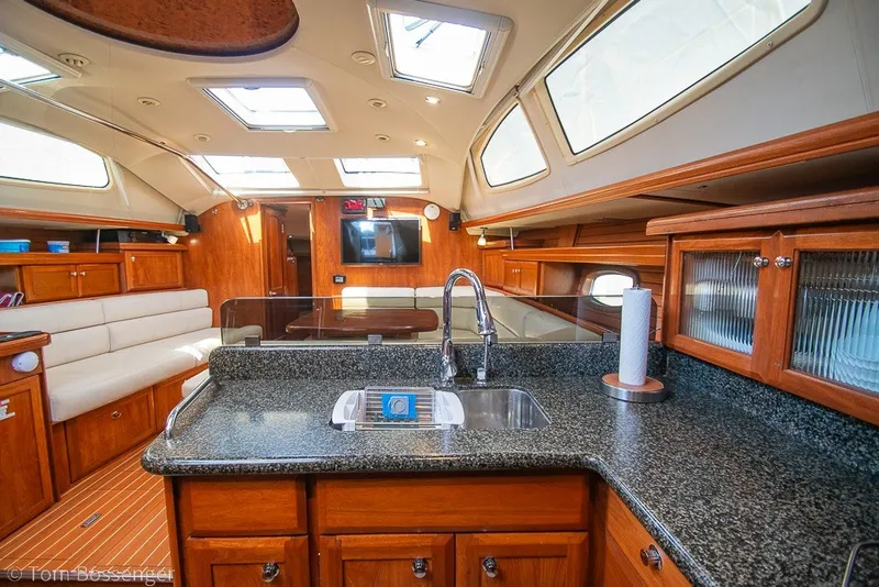 Slide: The Image of Luxurious interior of 2009 Hunter 50 Center Cockpit yacht with modern kitchen and seating area. - 16