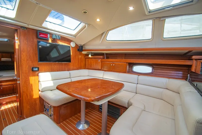 Slide: The Image of Luxurious interior of 2009 Hunter 50 Center Cockpit yacht with plush seating and wood finishes. - 18