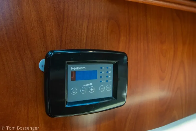 Slide: The Image of Digital control panel on 2009 Hunter 50 Center Cockpit yacht, mounted on wooden surface. - 21