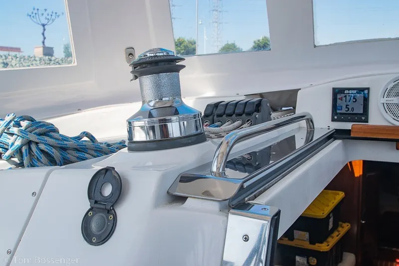 Slide: The Image of 2009 Hunter 50 Center Cockpit interior with winch, ropes, and navigation instruments. - 62