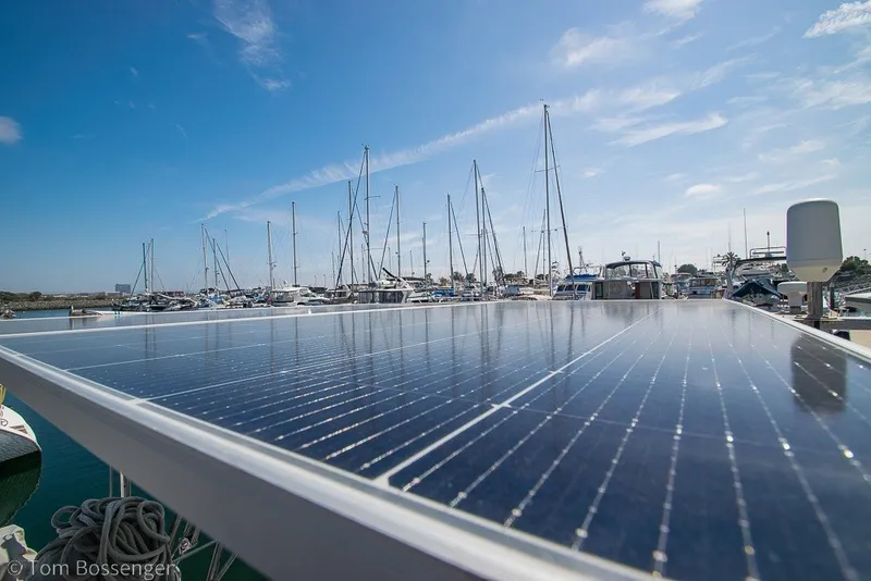 Slide: The Image of Solar panels on a 2009 Hunter 50 Center Cockpit yacht in a marina under clear skies. - 70