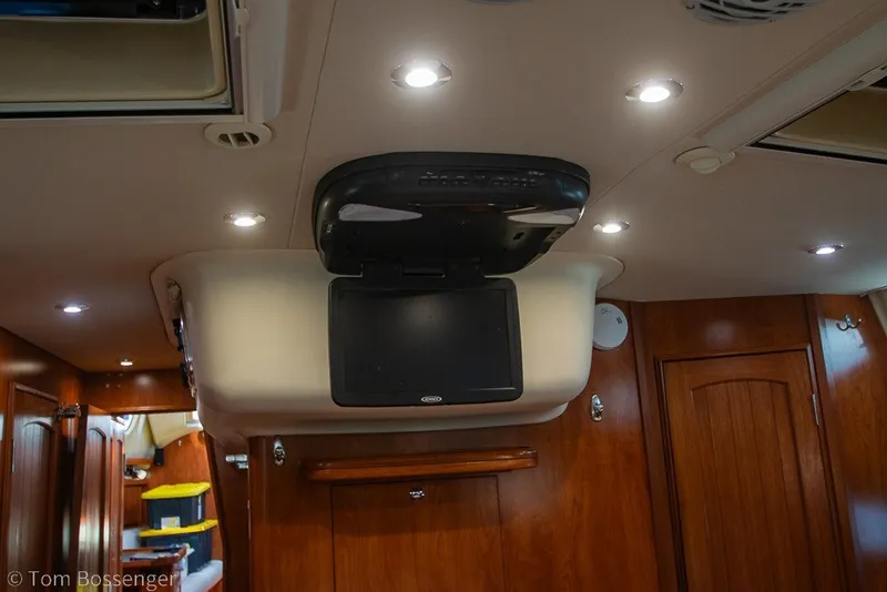 Slide: The Image of Interior of 2009 Hunter 50 Center Cockpit yacht with ceiling lights and mounted TV. - 39