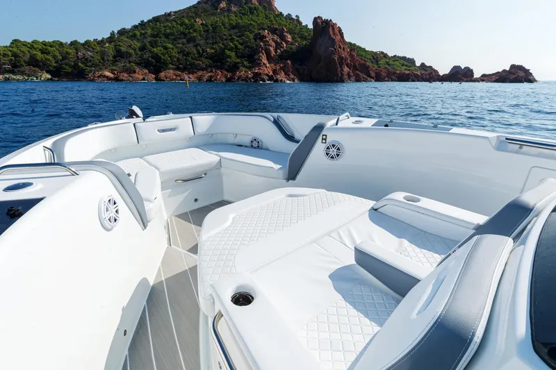 Slide: The Image of Luxurious Wellcraft 38 T-Top boat interior with scenic ocean and island backdrop, 2027 model. - 3