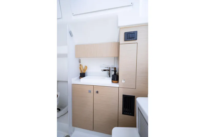 Slide: The Image of Modern interior of 2027 Wellcraft 38 T-Top boat with sleek cabinetry and sink. - 6