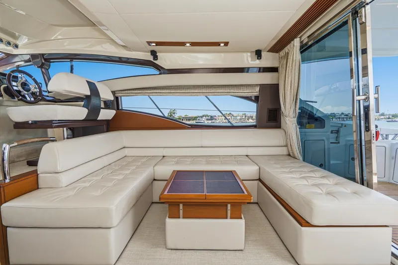 Slide: The Image of Luxurious interior of a 2012 Azimut 48 yacht with plush seating and elegant design. - 25