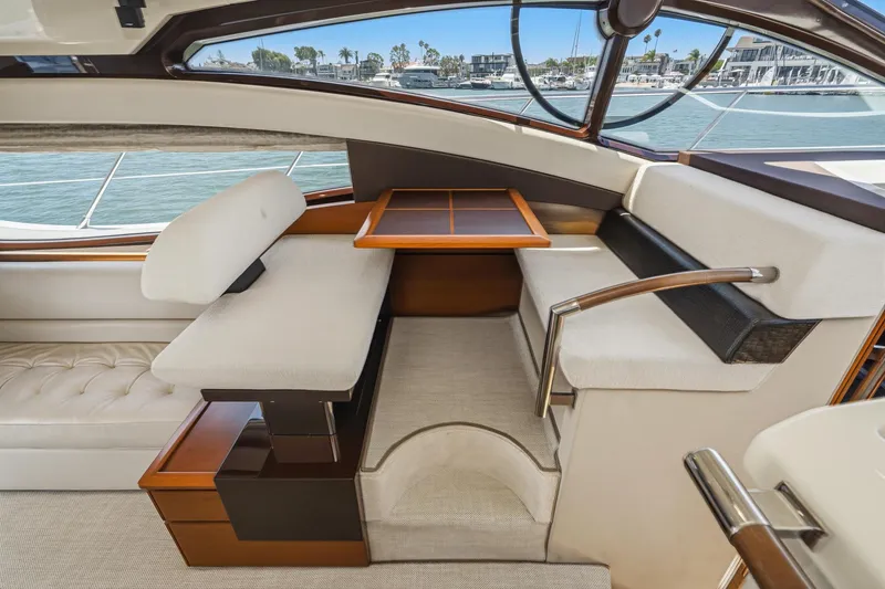 Slide: The Image of Luxurious interior of 2012 Azimut 48 yacht with elegant seating and table. - 27