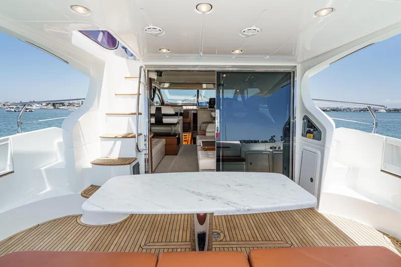 Slide: The Image of Luxurious 2012 Azimut 48 yacht interior with elegant seating and ocean view. - 19