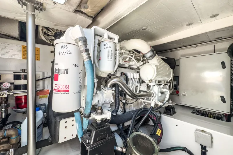 Slide: The Image of Engine room of a 2012 Azimut 48 yacht, featuring mechanical components and filters. - 54