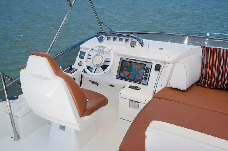 Slide: The Image of Helm of 2012 Azimut 48 yacht with leather seating and navigation display. - 11
