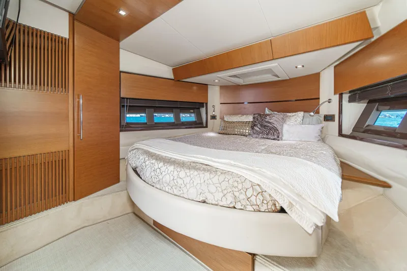 Slide: The Image of Luxurious bedroom interior of 2012 Azimut 48 yacht with elegant wood finishes and plush bedding. - 38