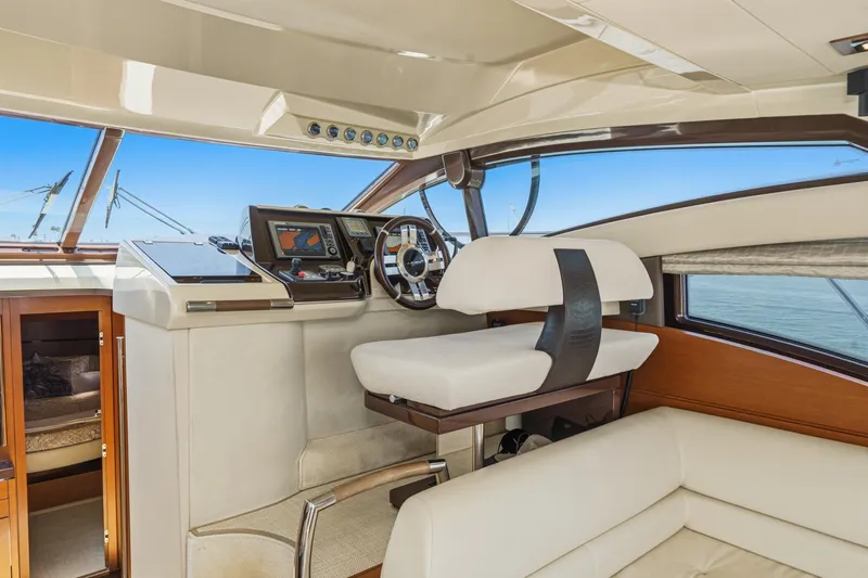 Slide: The Image of Luxurious interior of 2012 Azimut 48 yacht with modern helm and seating. - 28