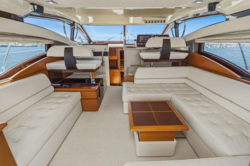 Slide: The Image of Luxurious interior of a 2012 Azimut 48 yacht with elegant white seating and wooden accents. - 22