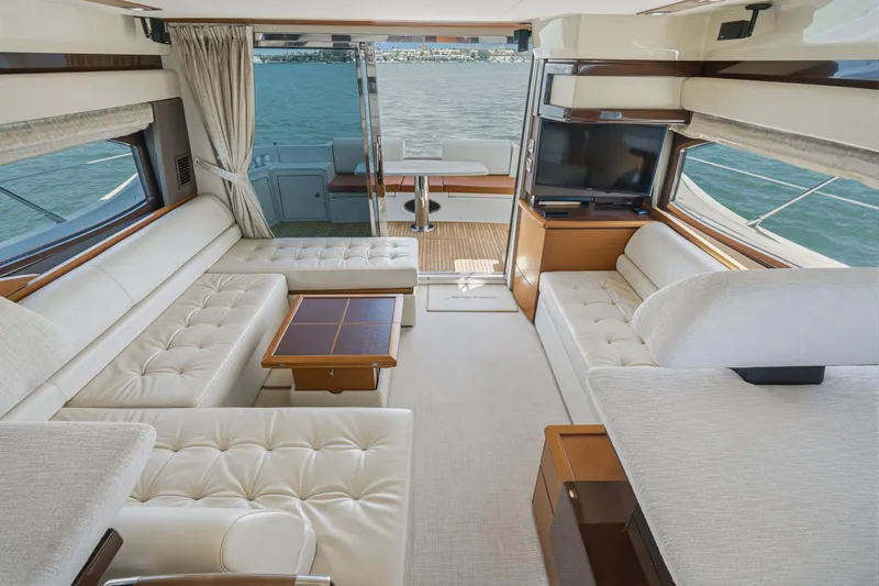Slide: The Image of Luxurious interior of a 2012 Azimut 48 yacht with elegant seating and scenic water views. - 23