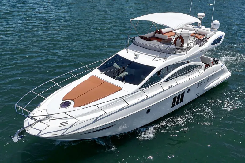 Slide: The Image of Luxurious 2012 Azimut 48 yacht cruising on open water, featuring sleek design and spacious deck. - 60
