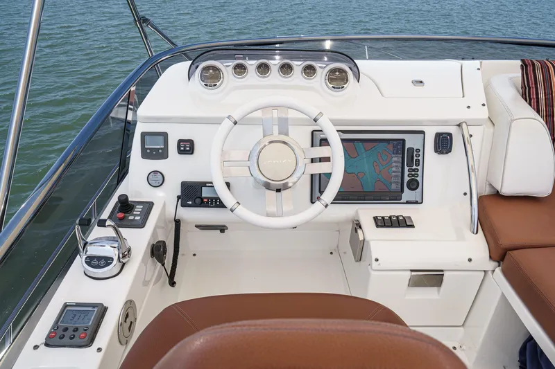 Slide: The Image of Cockpit of 2012 Azimut 48 yacht with modern navigation controls and leather seating. - 12