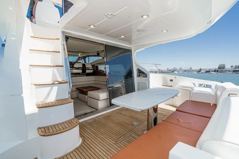 Slide: The Image of Luxurious 2012 Azimut 48 yacht interior with elegant seating, table, and scenic ocean view. - 18