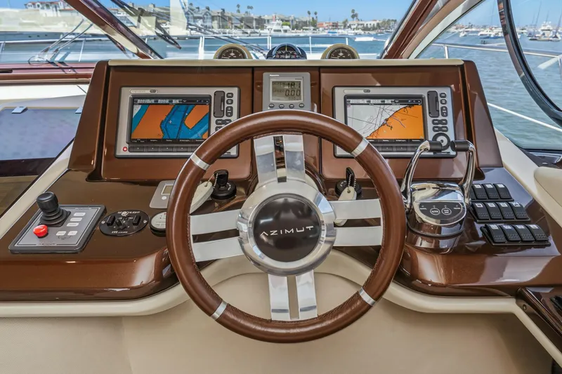 Slide: The Image of Cockpit of 2012 Azimut 48 yacht with navigation screens and controls. - 31