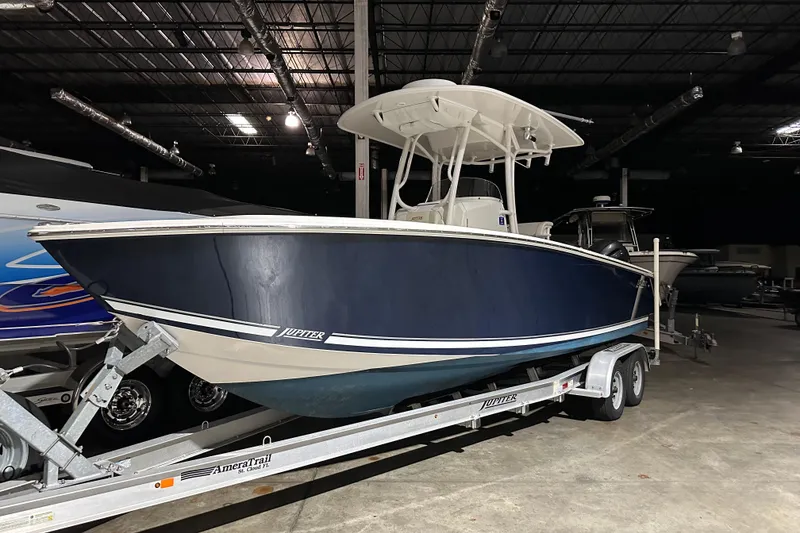 Slide: The Image of 2013 Jupiter 26 FS boat on trailer in indoor showroom. - 10