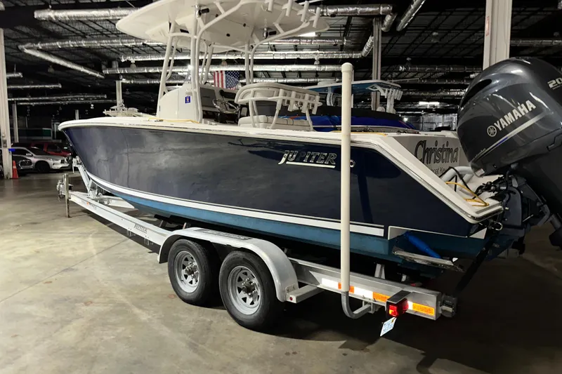 Slide: The Image of 2013 Jupiter 26 FS boat on trailer with Yamaha engine in indoor storage. - 9