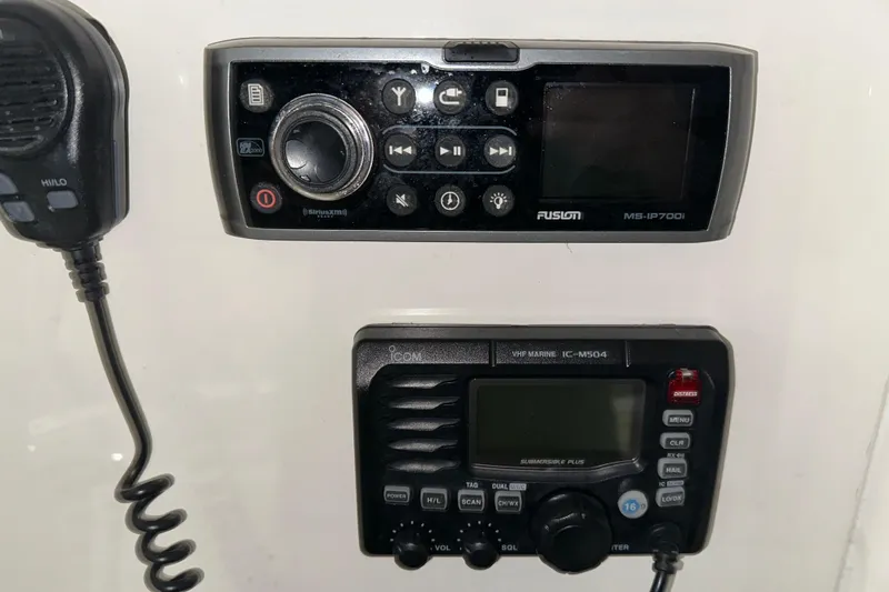Slide: The Image of Control panel with Fusion MS-IP700i and Icom VHF Marine IC-M504 on 2013 Jupiter 26 FS. - 5