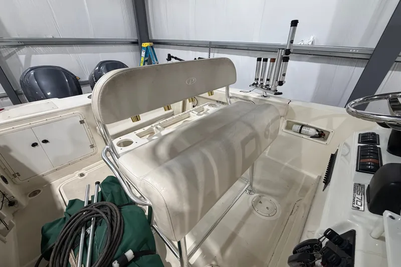 Slide: The Image of 2005 Pursuit 2670 Center Console boat interior with seating and equipment. - 18