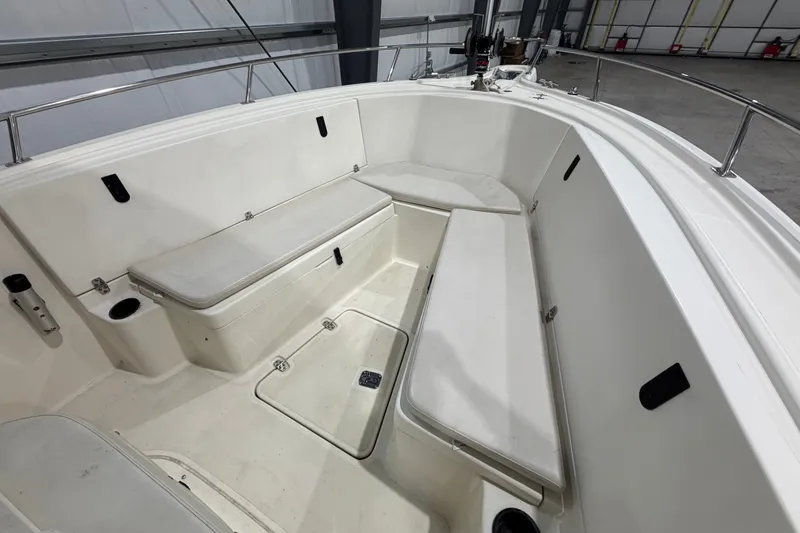 Slide: The Image of 2005 Pursuit 2670 Center Console boat interior with seating and storage compartments. - 15