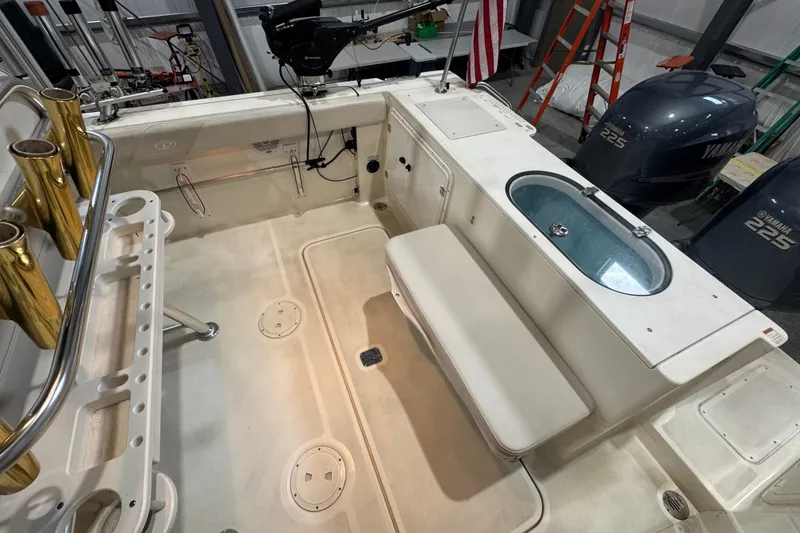 Slide: The Image of 2005 Pursuit 2670 Center Console boat interior with seating and Yamaha 225 engines. - 29