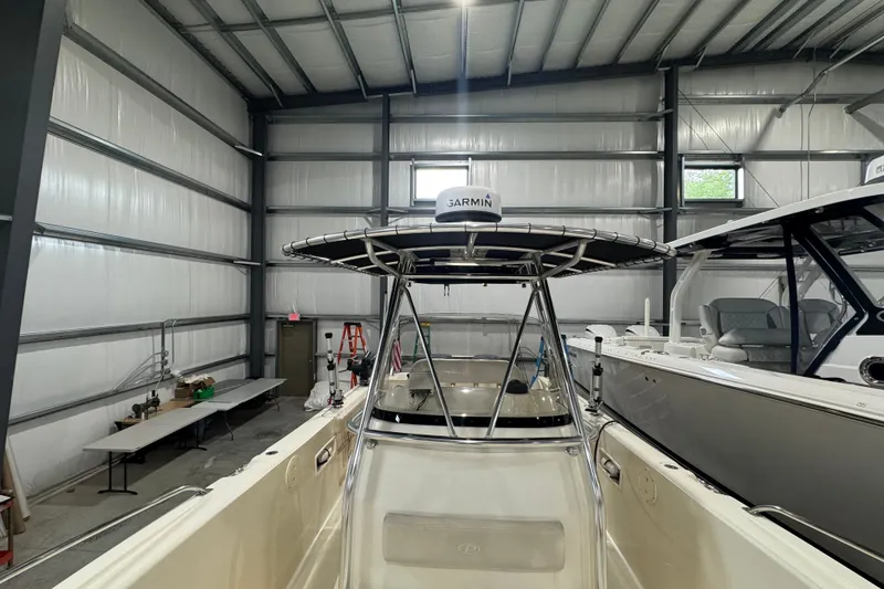 Slide: The Image of 2005 Pursuit 2670 Center Console boat in a storage facility. - 33