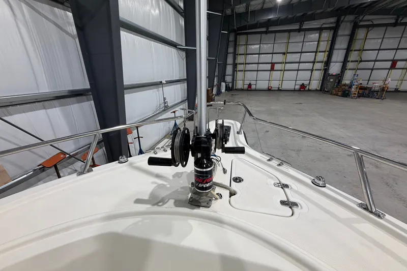 Slide: The Image of 2005 Pursuit 2670 Center Console boat in a spacious indoor storage facility. - 24