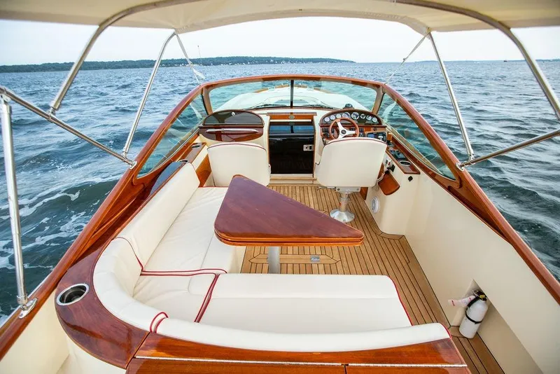Slide: The Image of Luxurious 2008 Hinckley Talaria 29R boat interior with elegant seating and wooden accents. - 14