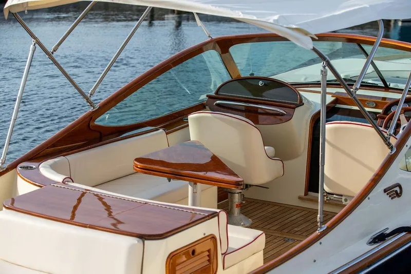 Slide: The Image of Luxurious interior of 2008 Hinckley Talaria 29R yacht with elegant wood finishes. - 16
