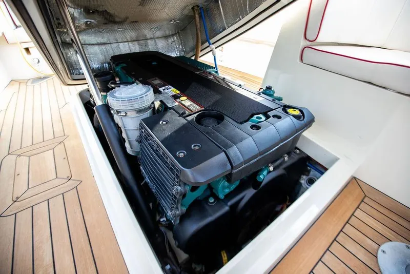 Slide: The Image of Engine compartment of a 2008 Hinckley Talaria 29R boat, showcasing detailed mechanics. - 22