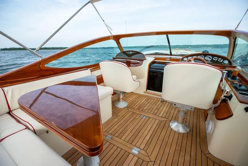 Slide: The Image of Luxurious 2008 Hinckley Talaria 29R boat interior with elegant wood and leather seating. - 15